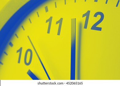 Closeup of hands on clock face