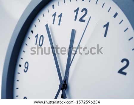 Close-up of hands on clock face