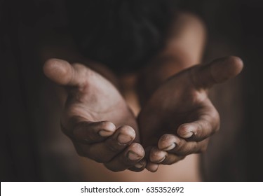 closeup hands poor child begging you for help concept for poverty or hunger people, Human Rights,background text. 