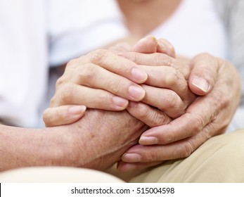 close-up of hands of a senior couple held together, concept for love, help, comforting and consoling - Powered by Shutterstock