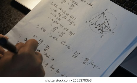 Close-up of Hands Solving Geometric Problem on Paper