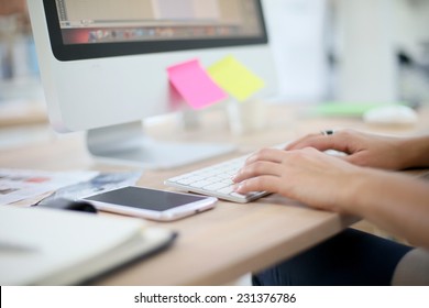 Closeup Of Hands Typing On Desktop Keyboard