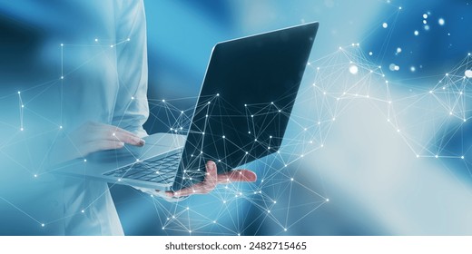 Close-up of hands typing on a laptop with digital network connections on a blue abstract background, concept of technology - Powered by Shutterstock