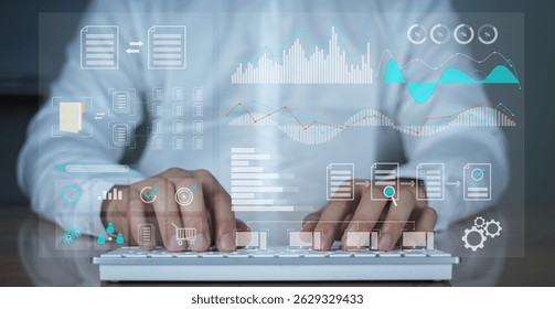 Close-up of hands typing on a white keyboard with overlay of digital business interface including graphs, analytics, and dashboard icons. Represents modern office, business intelligence, big data.