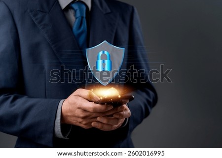 Close-up of hands using a mobile phone with a digital technology cybersecurity icon, representing data encryption, privacy, and secure online access. internet network firewall protect.
