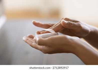 Close-up of Woman’s Hands Using Powder Puff