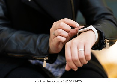 Close-up hands using smart watch app