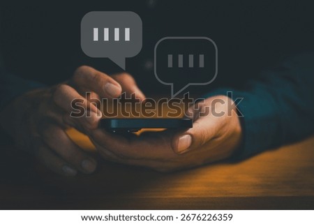 Close-up of hands using smartphone with chat bubbles, symbolizing online messaging, instant communication, mobile chat apps, digital conversation, customer support, social interaction in technology.