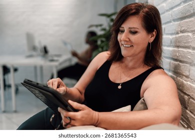 Close-up of hands using stylus on digital tablet, emphasizing precision and creative interaction in modern technology for work or design tasks.