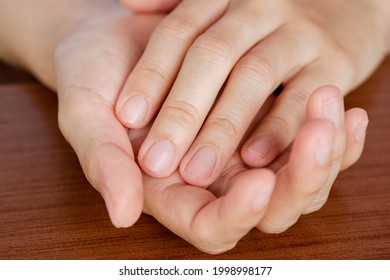 Close-up Hands Of A Woman Whose Nails Were Cut Short And Clean. The Concept Of Care, Clean Fingernails.