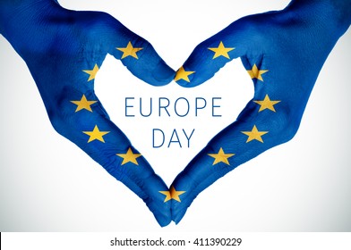 closeup of the hands of a young woman forming a heart patterned as the flag of the European Union and the text Europe Day - Shutterstock ID 411390229