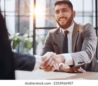 closeup of handshake of business partners - Shutterstock ID 2333966907