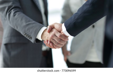 Closeup Of Handshake Of Business Partners