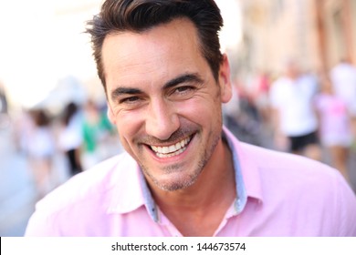 Closeup of handsome guy wearing pink shirt - Powered by Shutterstock