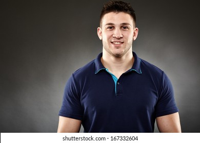 Closeup Of Handsome Young Man Wearing A Navy Blue Polo T-shirt