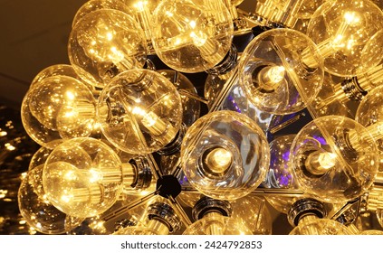 Close-up hanging light bulb pattern background.