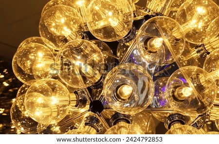 Close-up hanging light bulb pattern background.