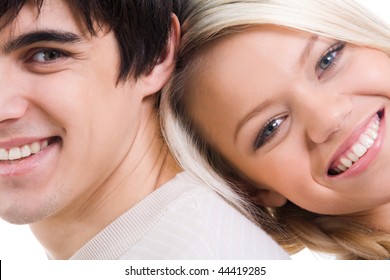 Close-up of happy couple looking at camera with smiles
