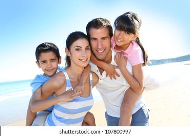 Closeup Of Happy Family At The Beach