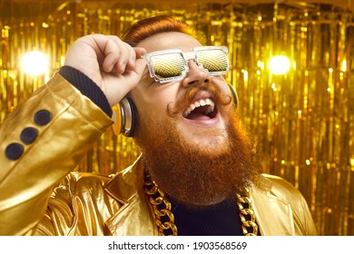 Closeup Of Happy Funny Smiling Man With Ginger Beard And Stylish Handlebar Mustache In Bling Golden Outfit And Cool Glasses Reflecting Disco Night Party Lights. Eyewear Style And Having Fun Concept