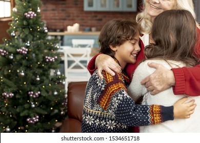 Close-up Happy Grandmother Hugging Grandchildren