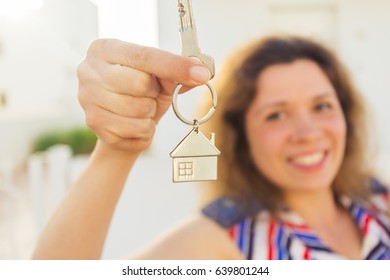 Close-up Of Happy House Owner Or Renter Showing Keys And Looking At You