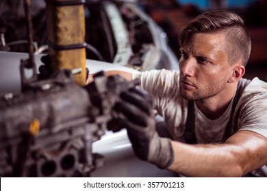 Close-up Of Hard Working Sweaty Dirty Mechanic