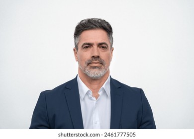 Closeup headshot face portrait of worried boss businessman isolated on white studio background. Latin hispanic middle age focused man, manager, ceo in formal business suit looking stressed at camera - Powered by Shutterstock