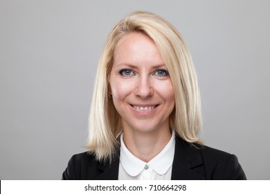 Closeup Headshot Of Young And Happy Business Woman 