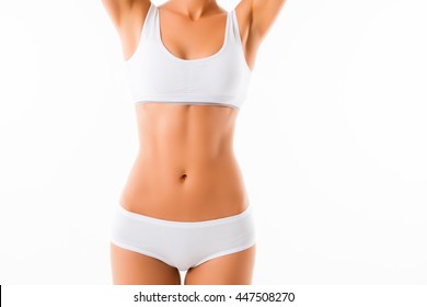 Close-up healthy fit slim woman in white undewear on white background