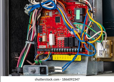 Closeup of heater circuit control board inside of furnace. Concept of HVAC maintenance, repair, service and installation