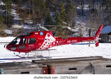 Close-up of helicopter type Eurocopter AS350 B3 Ecureuil register HB-ZVS at heliport of Air Glaciers at Mountain Village Lauterbrunnen. Photo taken January 15th, 2022, Lauterbrunnen, Switzerland.