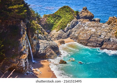 Close-up Of Hidden Waterfall In Coastal Ocean Cove