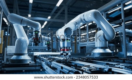 Close-up of High Precision Robot Arms on Automated PCB Assembly Line Inside Modern Electronics Factory. Component Installation. Board. Electronic Devices Production Industry. Manufacturing Automation