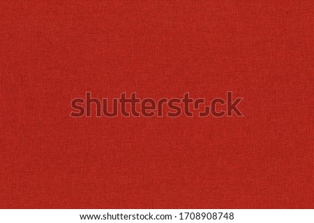 Close-up hight resolution texture of natural red fabric or cloth in light red color. Fabric texture of natural cotton or linen textile material. Red canvas background.