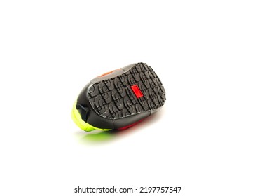 Close-up high-traction rubber outsole of slip-on shoes mules isolated on white background. Ripstop upper, collapsible heel warmth and comfort sneaker footgear.