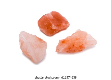 Closeup Of Himalayan Pink Rock Salt Isolated Over White Background