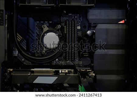 Close-up Hi-performance custom computer desktop for work, play game eSport and entertain on  Metaverse VR with cooling pump installed on CPU processor and multicolored LED neon light show on working