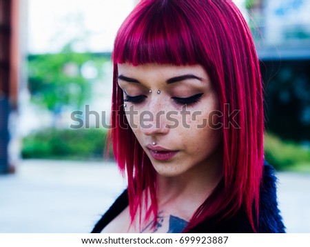 Close-Up Hipster Woman With Pierced And Dyed Hair