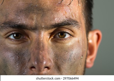 Closeup Hispanic Man Dirty Face Eyes And Nose Caption Looking To Camera.