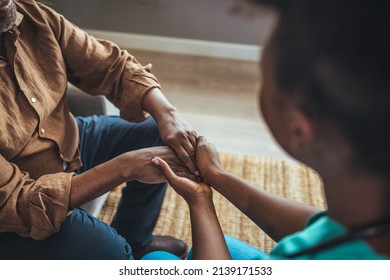 Close-up Of Home Caregiver And Senior Woman Holding Hands. Professional Elderly Care. Professional Care For Elderly At Nursing Homes. Nurse Holding Hand Of Senior Man In Rest Home