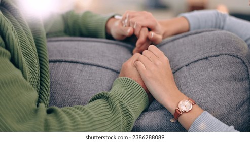 Closeup, home and couple with love, holding hands and support with romance, bonding together and relax. Romantic, man and woman with connection, affection and marriage with relationship and apartment