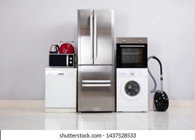 Close-up Of Home Electronic Appliances On Floor Against Grey Wall In New House - Shutterstock ID 1437528533