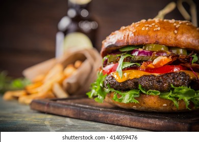 Close-up of home made tasty burgers on wooden table. - Powered by Shutterstock