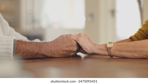 Closeup, home and senior couple holding hands, trust and sympathy with compassion, empathy and kindness. Apartment, old man and mature woman with faith, prayer and relax with love, care and comfort - Powered by Shutterstock