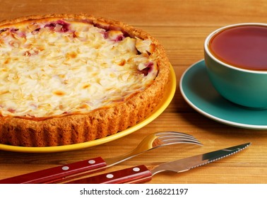 Closeup Homemade Berry Pie And Cup Of Tea On Wooden Table. 