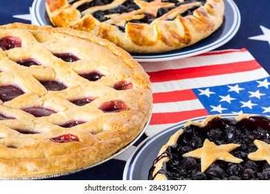 Closeup Of Homemade, Fresh Baked Blueberry Pies And Triple Berry Pie.