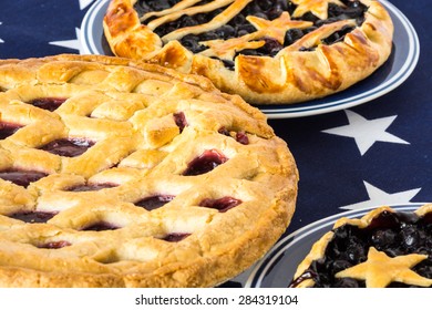 Closeup Of Homemade, Fresh Baked Blueberry Pies And Triple Berry Pie.