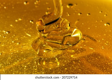 Closeup Honey Pouring Waves