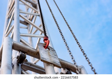 Close-up Of A Hook With A Metal Chain On A Metal Frame Of Stage Lighting In A City Square